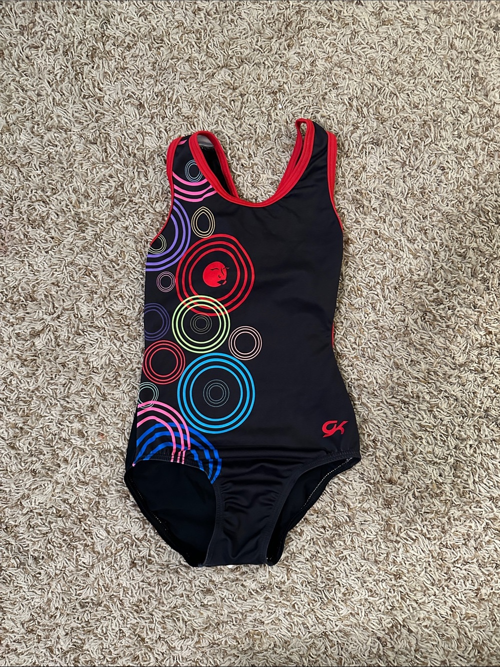 GK Black One-Piece leotard with Red Trim and Multicolor Ring Print
